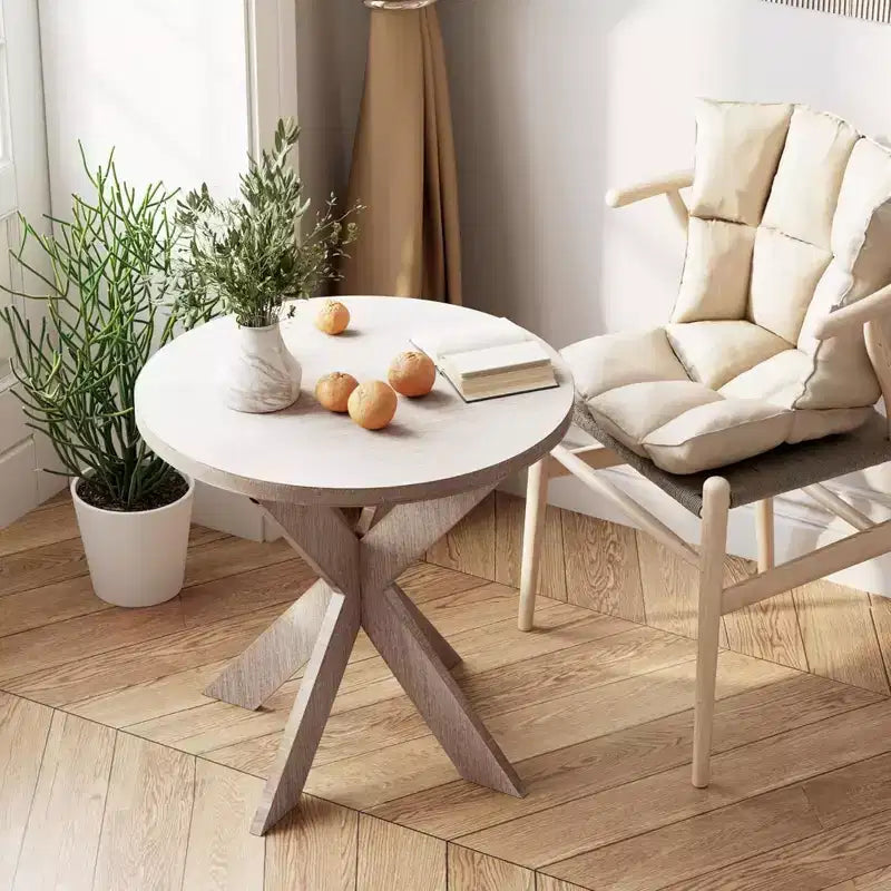 Tavolino finale rotondo rustico in legno con gambe incrociate, finitura grigio vintage