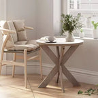 Tavolino finale rotondo rustico in legno con gambe incrociate, finitura grigio vintage